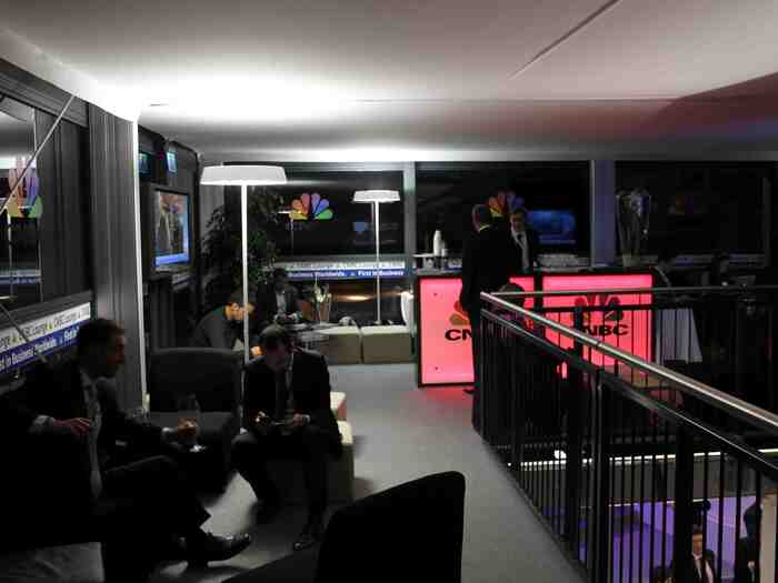 And at the OTHER end of the hall, just above the coat check, is the CNBC lounge. There was a chair free when I arrived. The U.S. market was about to close, and they had TVs showing CNBC. So I took a break. It was only 10pm, after all. I