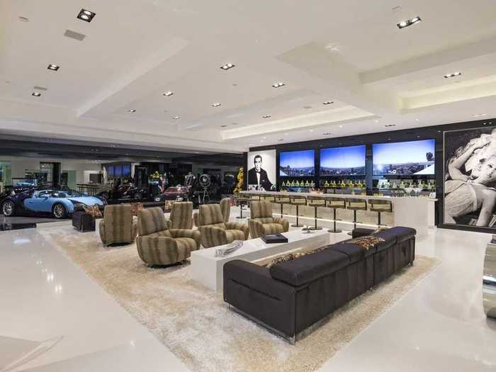 And this house is absolutely insane, featuring such amenities as an 18-seat home theater, $5,000 toilets, 16-car garage, and an enormous bar stocked with Dom Perignon.