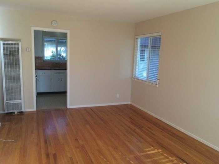 This older-looking apartment in Palo Alto has some modern appliances.