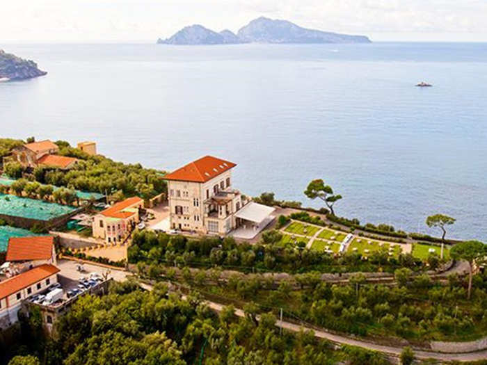 ITALY: Situated on over 25 acres of olive groves, vineyards, and citrus groves, this home overlooks the Gulf of Naples. The estate includes several buildings, and the main house has four levels and two elevators. The entire property is selling for $61 million.