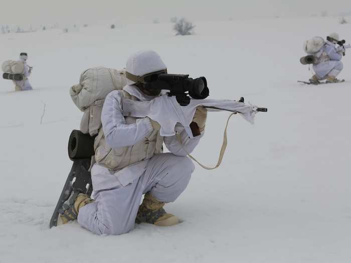 Sometimes the guns are equipped with a special trigger guard that fits the heavy mittens worn by the soldiers.