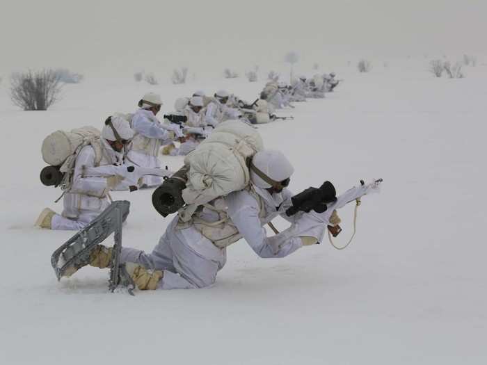 The soldiers also wear special camouflage uniforms to hide in the snow.