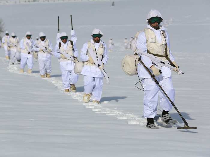 These soldiers are looking for landmines.