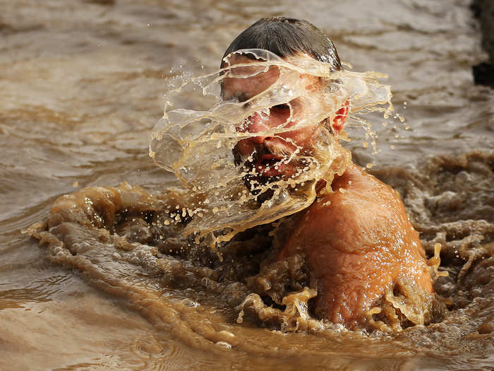 One section involves swimming through freezing muddy water.