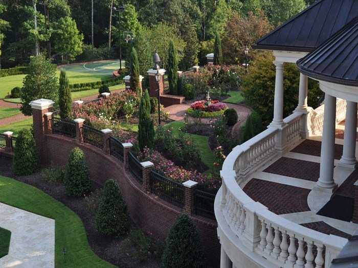 Gardens and landscaped walls surround the house, true to the estate