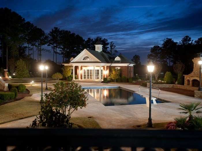 A pool house, separate from the main home, also sits in the backyard.