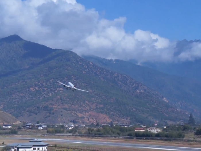 Planes taking off seem to be on a collision course with a hillside.