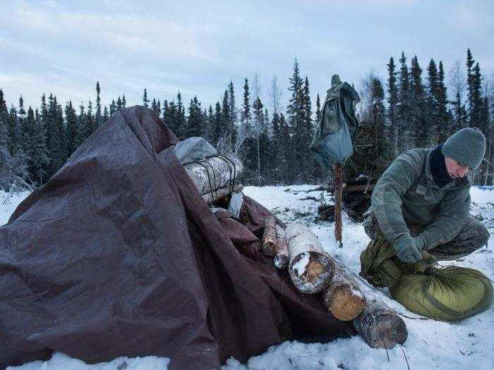 During the second day, instructors teach students to make more complex A-frame shelters out of wood and a parachute or tarp.