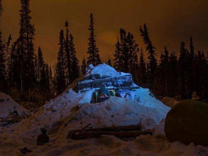 The A-frame is then covered with almost a foot of snow to provide insulation.