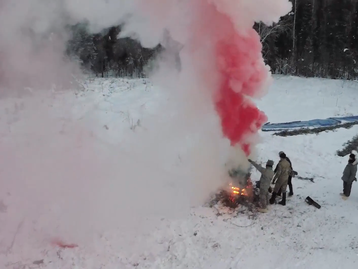 Next to the smoke signal, students create a giant letter 