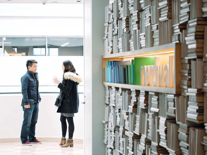 CEO Tim Chen and VP of marketing Stephanie Wei talk near the entrance to Nerdwallet.