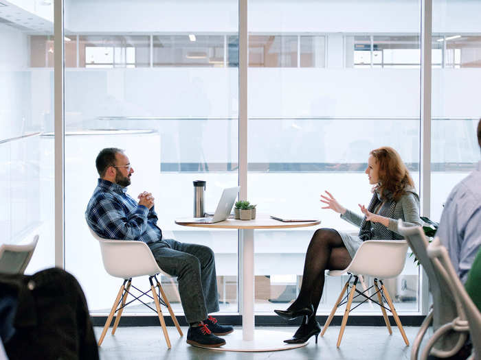 There are lots of different seating areas around the office.