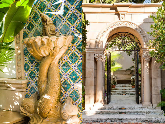 Spectacularly ornate fountains, stone archways, and wrought iron gates greet you.