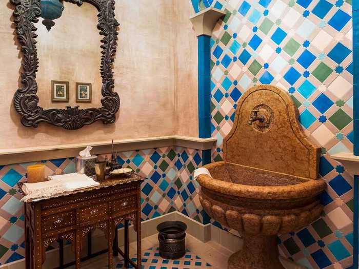 The other five and a half bathrooms are just as lavish, but this one is especially unique, with colorful tiling and a ginormous stone sink.