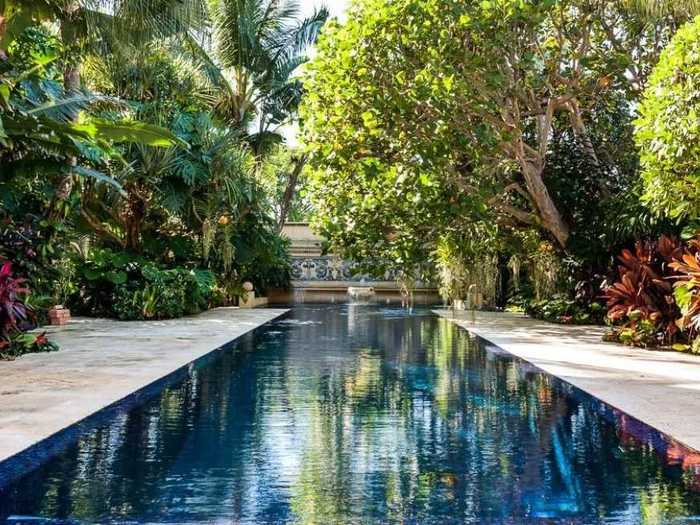 The 50-foot pool is outfitted with "shimmering glass tiles."