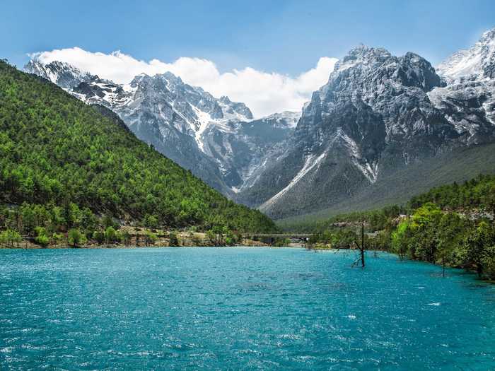 Drive around Jade Snow Mountain in Yunnan and admire the incredible scenery.