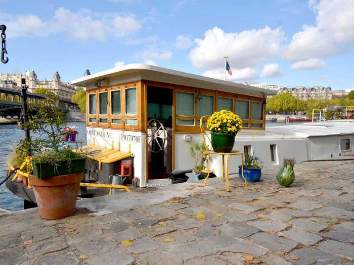 Float in a romantic houseboat near the Eiffel Tower.