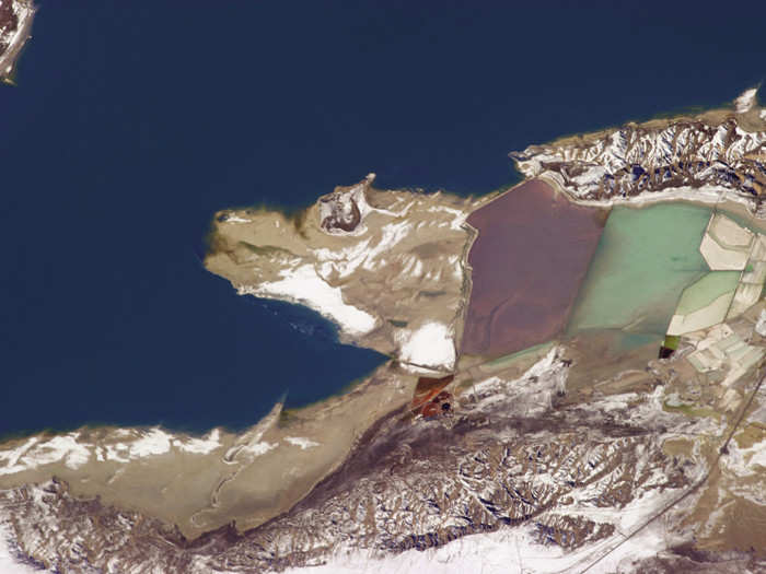 The Great Salt Lake in Utah is the largest saline lake in the western hemisphere. "No perspective is more radically different than the one you get when you leave the planet altogether and look back," Hadfield writes. And this is certainly true here, where you can see some of the saltiest parts of the lake in red where brine shrimp are raised and magnesium-chloride brine is extracted to produce magnesium metal.