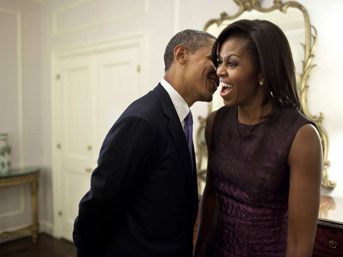 Barack whispers something to Michelle during a break between events at the 2011 UN General Assembly.