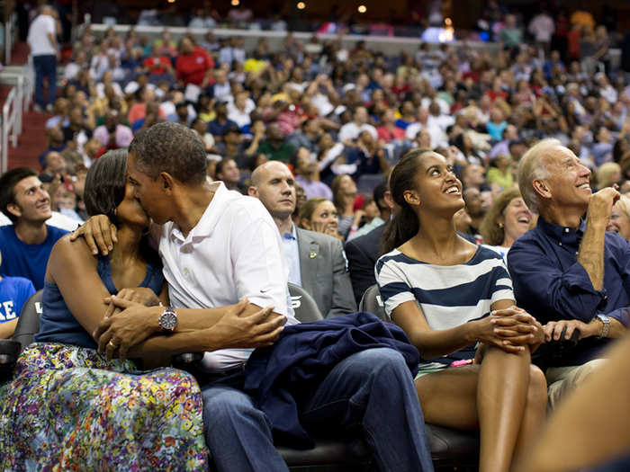 The First Couple smooches for the KissCam during a timeout at an Olympic basketball exhibition game in 2012.