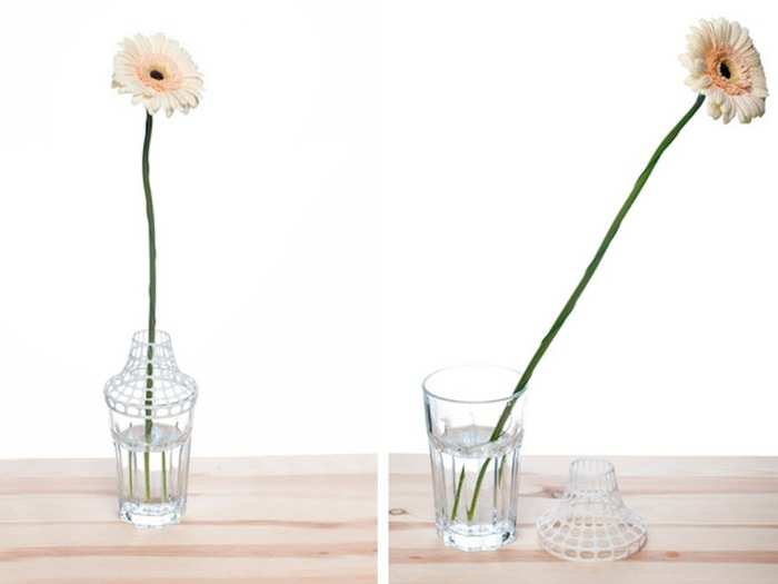 Next time someone surprises you with flowers, try this 3-D printed object that clips onto drinking glasses to turn them into vases.