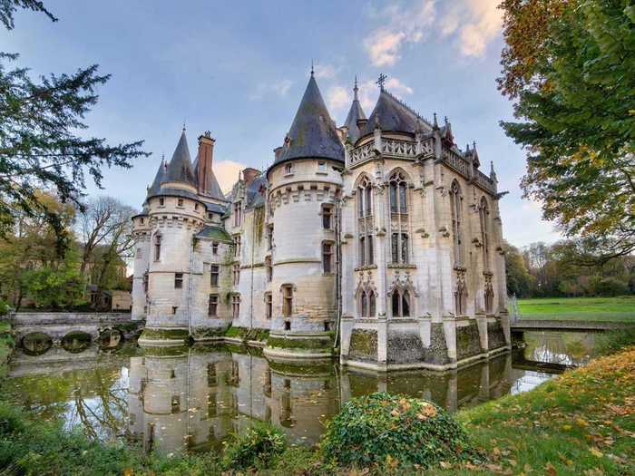 A moat-turned-water feature surrounds the main structure, but there