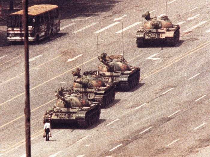 A man, famously known as "Tank Man," stands in front of a convoy of tanks in the Avenue of Eternal Peace in Tiananmen Square in Beijing in this June 5, 1989 photo.