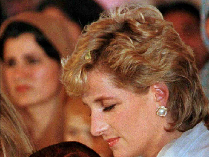 Diana Princess of Wales cradles a young child stricken with cancer during a show at the Shaukat Khanum Memorial Cancer Hospital in Lahore, February, 1997.