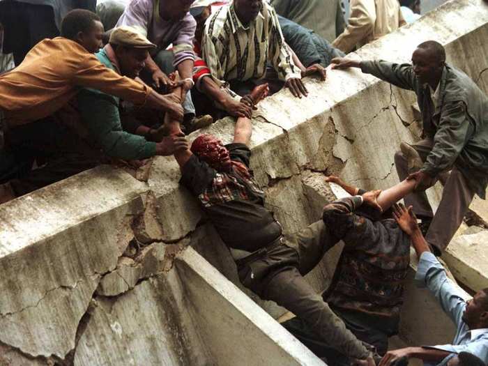 A body is removed from the wreckage after a bomb went off in Nairobi, August 7, 1998. The bomb, which killed more than 250 people and injured 5,000, was aimed at the U.S. embassy.  It destroyed a neighboring building and badly damaged the embassy.