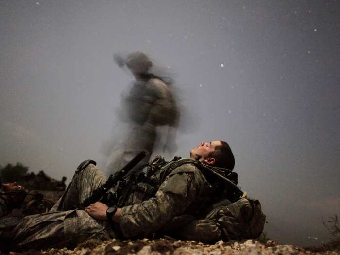 A U.S. soldier of 2-12 Infantry 4BCT-4ID Task Force Mountain Warrior takes a break during a night mission near Honaker Miracle camp at the Pesh valley of Kunar Province of Afghanistan in August, 2009.