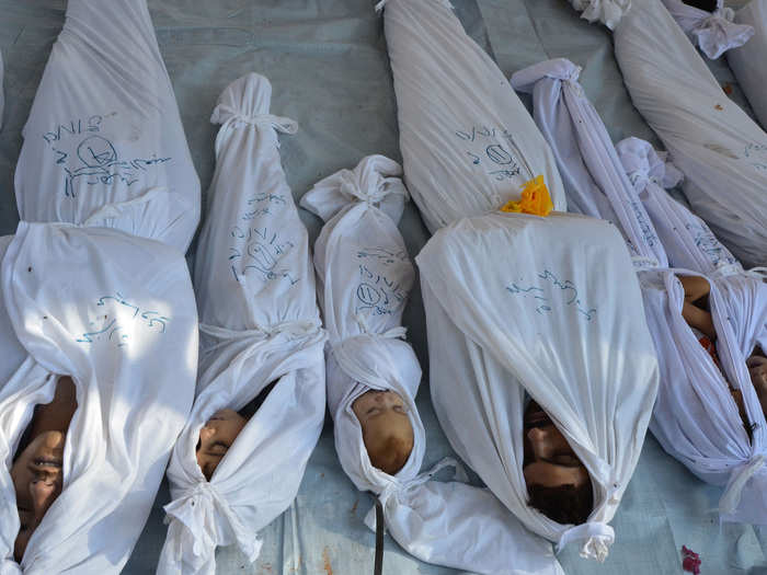 Bodies of people activists say were killed by nerve gas in the Ghouta region are seen in the Duma neighbourhood of Damascus August in this 21, 2013 photo. Syrian activists said at least 213 people, including women and children, were killed in a nerve gas attack by President Bashar al-Assad