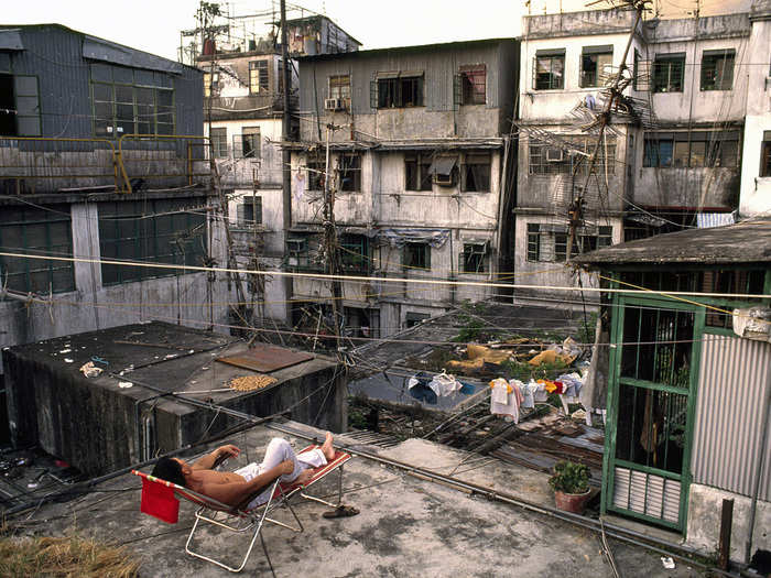 Because of the smelly, humid conditions down below, the rooftops of Kowloon would turn into a communal hangout during the afternoons and evenings. People would hang out, do laundry or homework, or practice instruments.