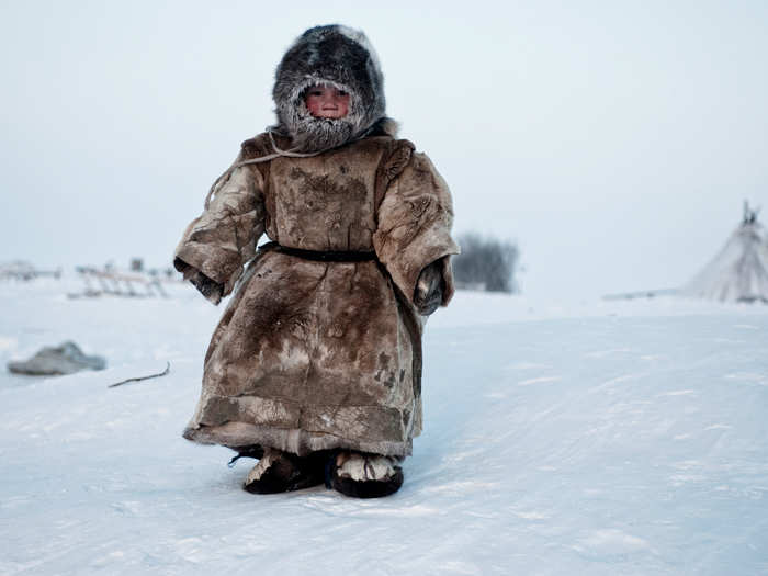 A young Nenets boy plays in -40 degree weather in Siberia. The Nenets are an indigenous group in Northern Russia.