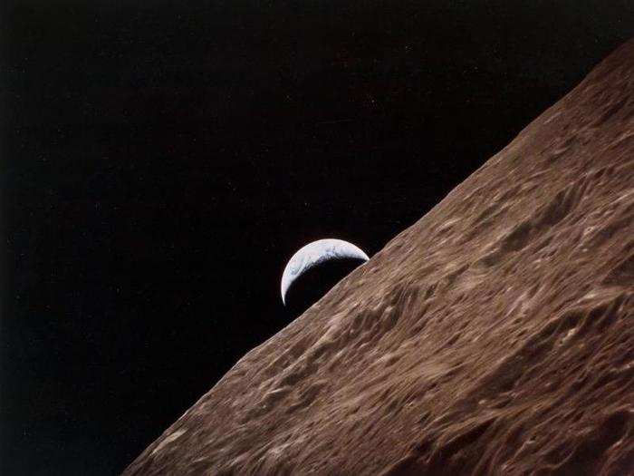 The crescent Earth rising from behind the Moon, during Apollo 17 in December 1972. Apollo 17 had the distinction of including a geologist, Harrison Schmitt. He and his colleague Gene Cernan — the last man to leave the Moon — spent three days and three hours on its surface.