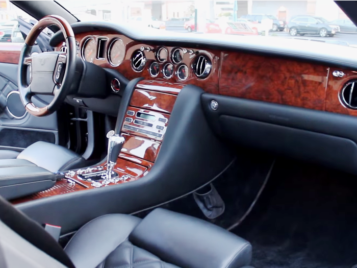 It has a sumptuous leather and wood interior.