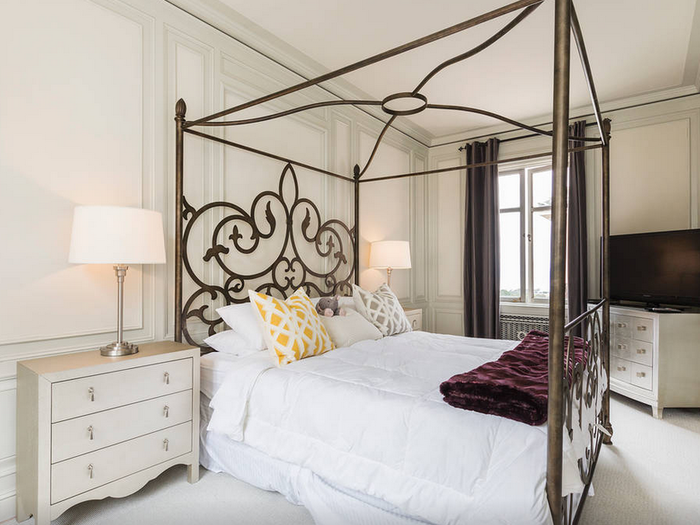 This four-poster bed will make you feel right at home when it