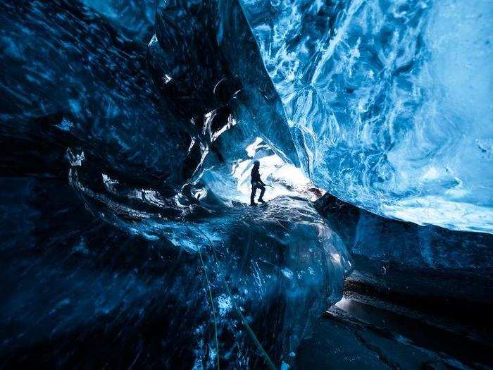 You can travel into an ice cave in a glacier. These caves are sometimes called the ‘Crystal Caves.’