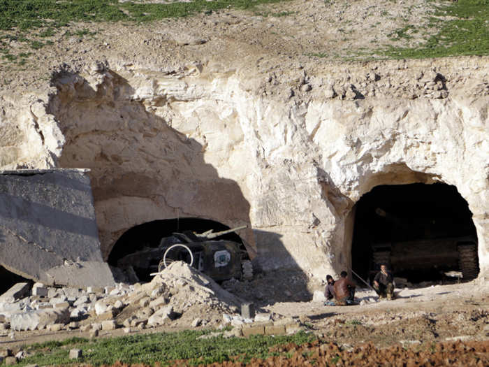 Anti-Assad rebels use the caves, too. In this March 2015 photo, fighters sit outside caves which they dug to be used as shelters and to hide their tanks in al-Latamna, in the northern countryside of Hama.