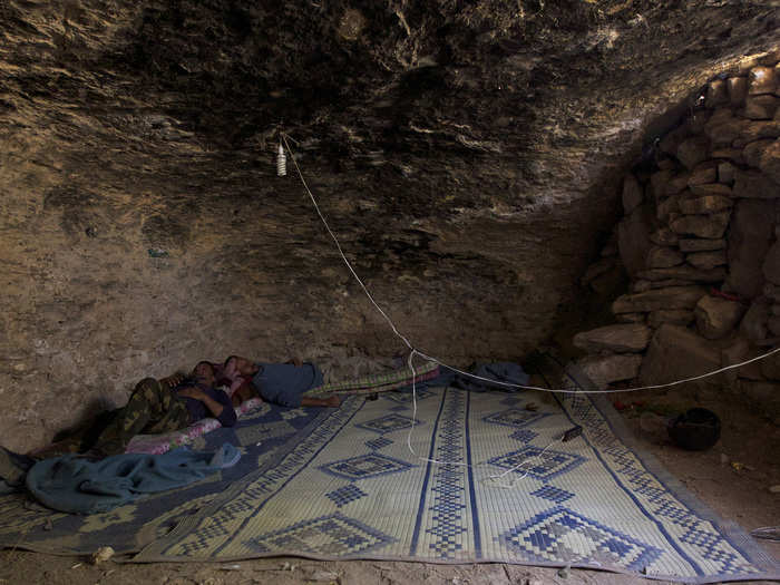 They also use the caves as a place to rest, as these Free Syrian Army fighters are doing in a shelter under Maaret al-Naaman village, in Idlib October 17, 2013.