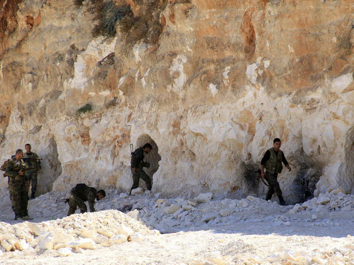 The caves are often compromised. Below, forces of Syrian President Assad inspect a base where caves were dug by rebel fighters in Zor al-Mahruqa village on October 6, 2014.