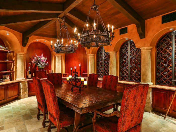 This more formal area features dramatic light fixtures and dark wood decor.