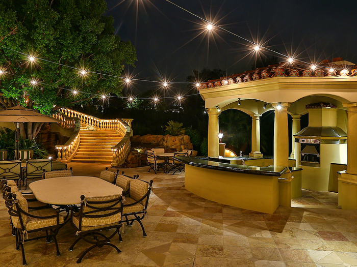 There are two outdoor kitchens, one that includes a pizza oven.