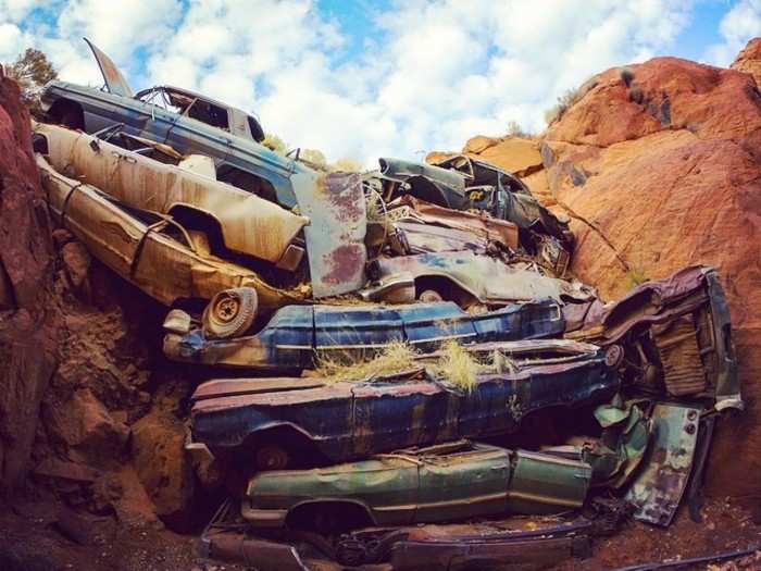 Car stack in a slot canyon reinforcing a Utah highway - "Redneck Flood Control"