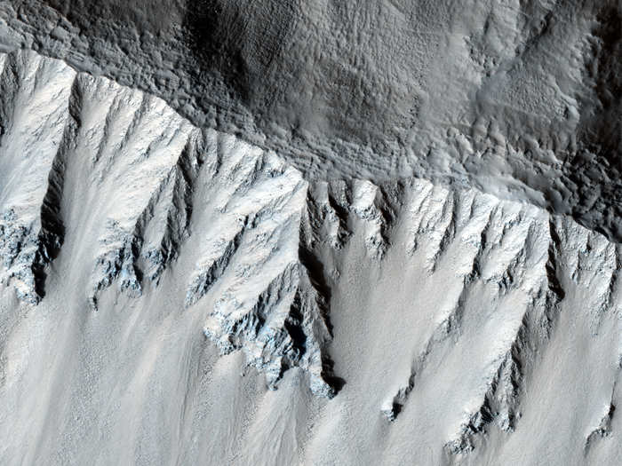 Here is the rim of a crater, which scientists think is relatively new because of how sharp it