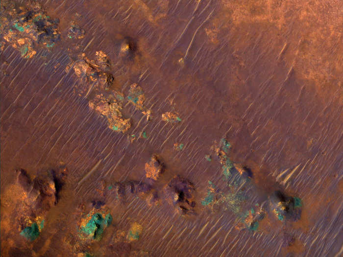 The Nili Fossae region on Mars is incredibly rich in clay deposits, shown here in orange. Organic materials could be preserved in this water-infused clay, which is why scientists are especially interested in this region on Mars. The blue-green regions are rocks rich in pyroxene, which is common in igneous rocks on Earth.