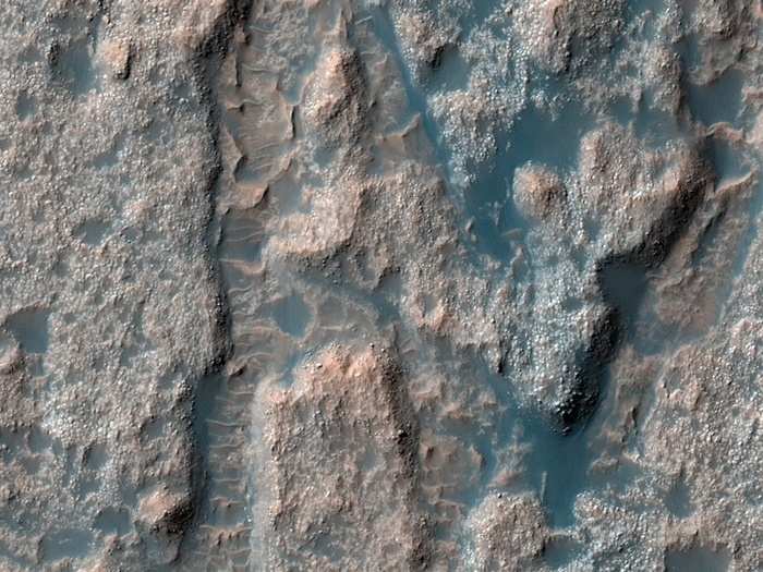 The textured surface in this image is part of the Palos Crater near the Martian equator. Scientists think that Palos Crater could have once harbored a lake that then drained to the north.