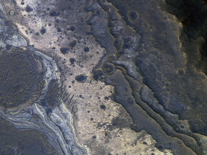 Layers of rock are stacked like a staircase in this image of the Samara Valles. The pink substance in the upper right is opal, which happens to be the national gemstone of Australia.