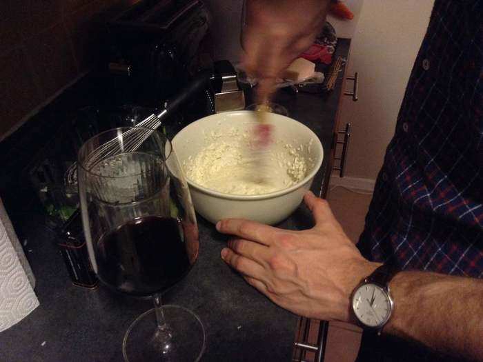 While your pasta is cooking, make the cheese paste. Combine the grated cheese, salt, and pepper with "just enough cold water to make a thick paste." Mash it together and spread it around the bowl.