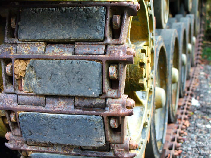 When a tank needs to drive on a paved road, it is outfitted with rubber pads like these ones to protect the tank