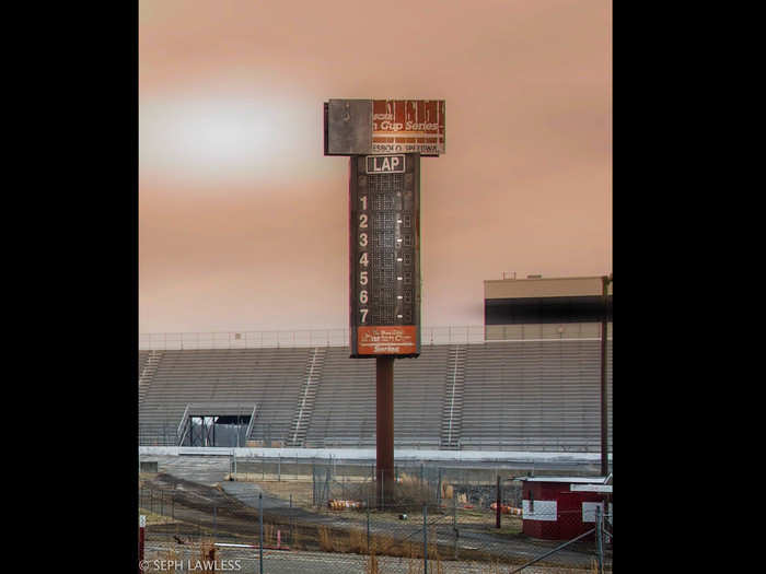 The lap-counting sign stands in stark contrast to the rest of the decaying track.